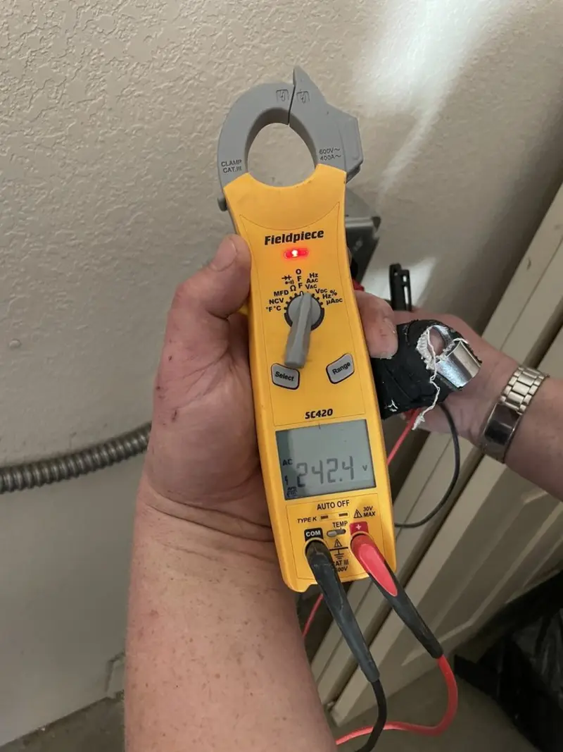 Voltage testing with clamp meter during Outlet Installation in Crest